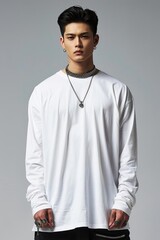 Fototapeta premium Longsleeve white Tshirt on a male model showcasing a rollup sleeve style