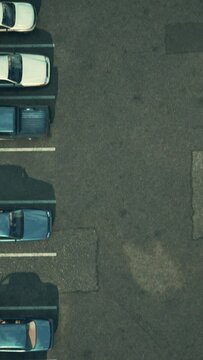 a parking lot filled with a large number of parked cars.