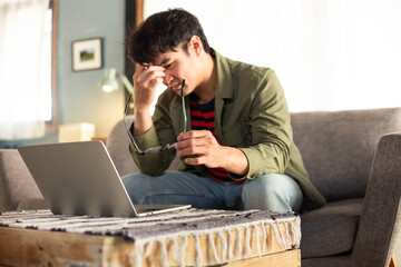 sad depression serious people from work,study stress problem.asian man feeling tired suffering using computer working work place.concept global economic,health problems