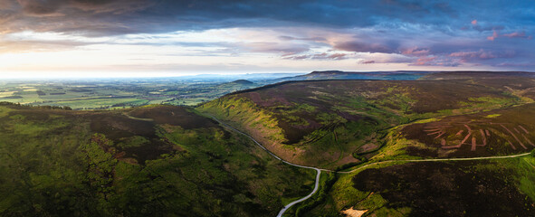 Panorama of Sunset over Cod Beck Reservoir from a drone, North York Moors National Park, North...