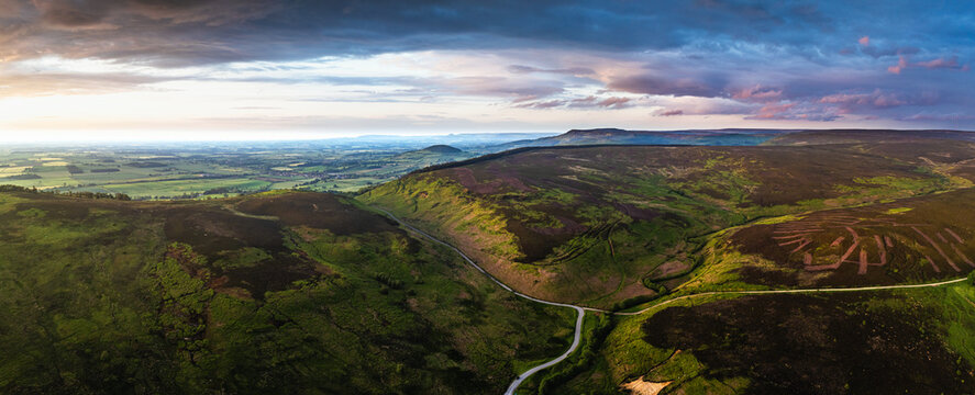 Panorama of Sunset over Cod Beck Reservoir from a drone, North York Moors National Park, North Yorkshire, England