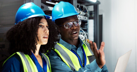 People, maintenance and laptop in server room talking, technician and firmware installation or...