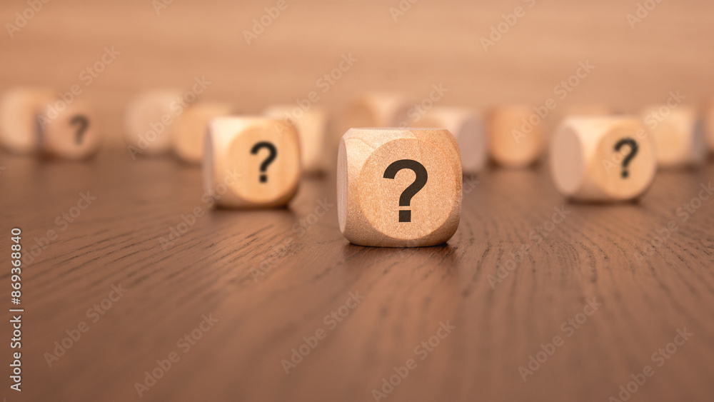Poster cube with question mark on wooden background. space for text