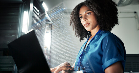 Laptop, server room and technician programming software, update or system network overlay....