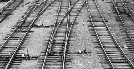 railway tracks and direction switching arrows, black and white background