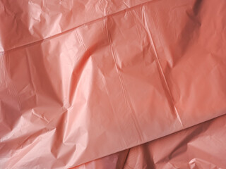 Fototapeta premium Old rose colored plastic bag texture for abstract background. 