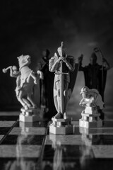 Fantasy chess pieces on a chessboard