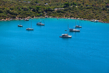 Obraz premium Beautiful incredible landscape with the sea, yachts, boats against the background of the Turkish Mediterranean coast on a sunny day, Kas.