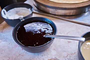 Jam in a pancake bowl. Self-service restaurant. Selective focus