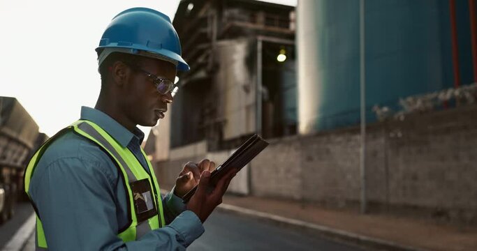 Man, engineer and tablet or infrastructure inspection online or construction development, progress or report. Black person, hardhat and industrial building or project contractor, digital or internet