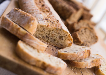 Fresh loaf of bread on wooden board