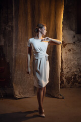 Fashionable clothes, old money style. Elegant blonde in a dress