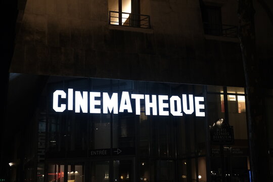A tight shot on the facade by night of the "Cinematheque" a place dedicated to cinema. Paris, France - March 4, 2024.

