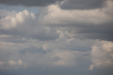 Blue sky. Beautiful Cumulus clouds flying across the sky,