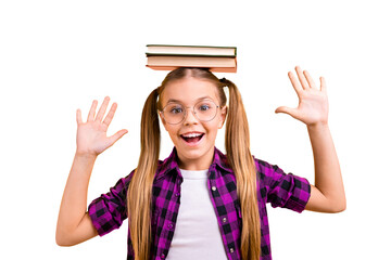 Closeup photo of little lady pupil hold book on head laughing raise arms air wear specs checkered shirt isolated yellow background