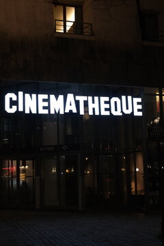 A tight shot on the facade by night of the "Cinematheque" a place dedicated to cinema. Paris, France - March 4, 2024.
