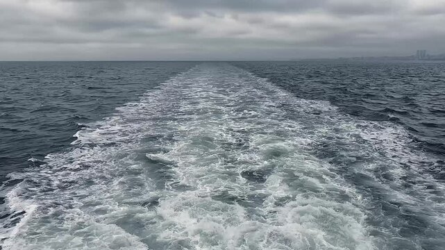 Wide wake from a sea ship. It's a nasty day