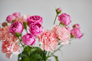 Bouquet of lilac roses and pink carnations