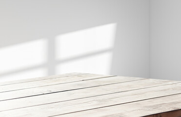 Shadow and light through a jalousie window on a tiled wall. Abstract shape of morning warm light and shadow on the wall..