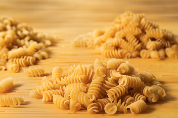 Heaps of raw fusilli pasta close-up. Italian raw pasta mockup