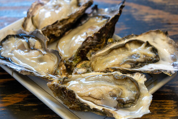 Oysters on the half-shell to be served for eaten raw