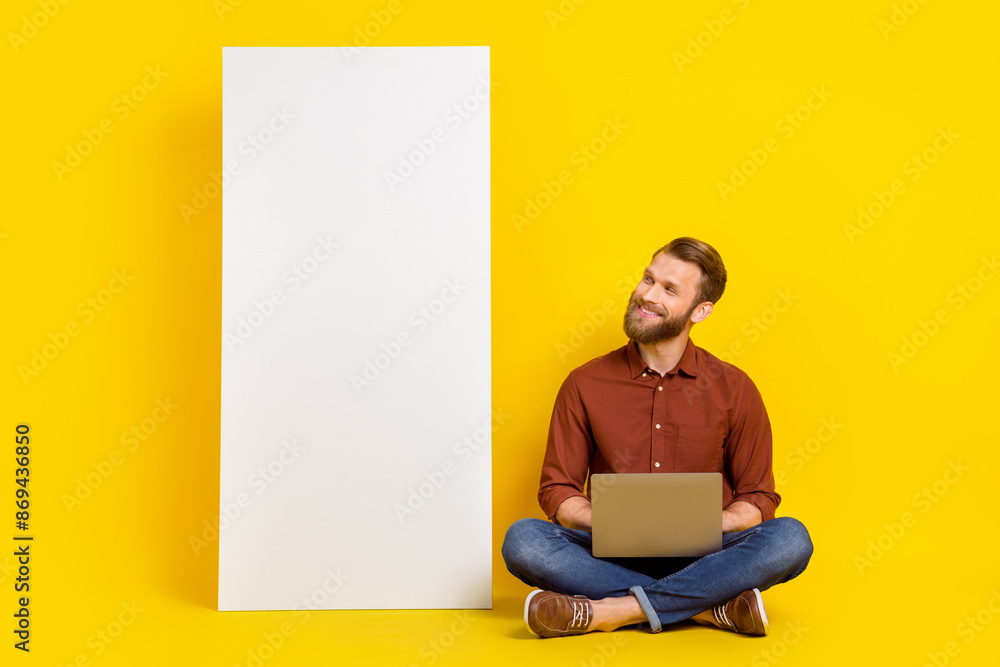 Aufkleber full body portrait of positive person sit floor use netbook use empty space banner isolated on yello