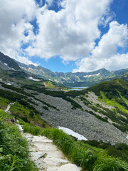 Naklejka premium Majestic views from the Tatra mountains. Stunning panoramic view of a lake nestled among the Polish mountains. Vertical 