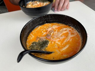traditional Laksa creamy coconut milk broth soup infused with aromatic spices and fresh seafood main dish