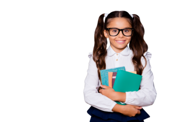 Glad positive nice smart cute small little girl with curly pigtails in white blouse shirt and blue skirt, carrying, keeping, hugging big book pile, copy-space. Isolated over black background