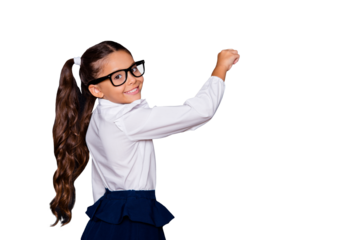 Portrait of nice genius cheerful adorable lovely small little girl with curly pigtails in white formal blouse shirt, blue skirt, writing on blackboard. Isolated over black background