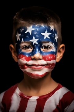 A child with a painted American flag on their face, smiling cheerfully and wearing a shirt with red and white stripes, set against a black background.