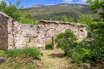 Fototapeta premium Ansignan, France. 05-23-2024. Old medieval chapel of Saint Nazaire at Ansignan in France.