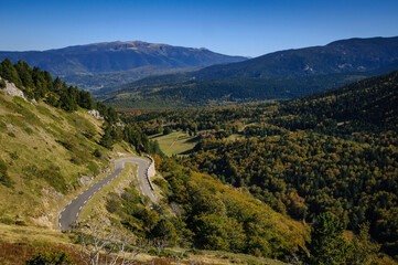 Donezan region in autumn, seen from the road to Col de Pailhères mountain pass. In the background, the Roc de Madres mountain (Ariège, Occitanie, France, Pyrenees)