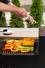Corn, green bean and bell peppers are cooked on the grill