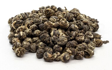 Jasmine Pearls tea on a white background 