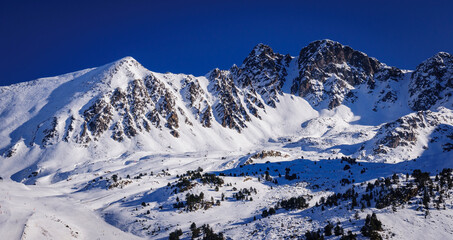 Pics d'Envalira peaks in a winter afternoon (Pessons cirque, Andorra, Pyrenees)
