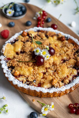 Freshly Baked Cherry Crumble Pie, Berry Pie over Summer Background