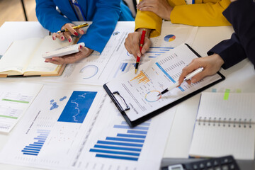 Meeting business consultants is discussing the analysis financial charts in company reports and...