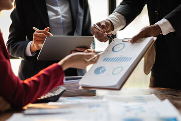 Fototapeta premium Business consulting meeting is discussing business plan analysis with financial data and business growth charts to plan strategies for generating company profits.