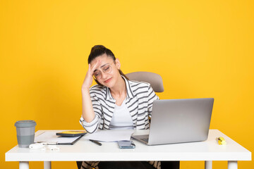 Frustrated business woman, portrait of young caucasian brunette frustrated business woman sit office desk using laptop computer. Having headache, tired, sad employee. Do something wrong. 