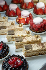 Various Sweets and Pastries Displayed on Shelves in a Bakery