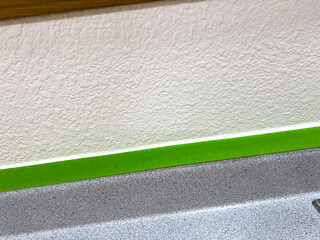 Fototapeta premium Close-Up of Masking Tape and Countertop Edge During Home Renovation