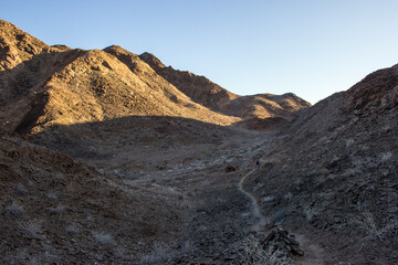 Late afternoon light over the desolate landscape with-in the Fish River Canyon