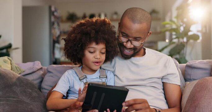 Father, child and relax with tablet on sofa at house for reading online ebook, storytelling or bonding together for support. Man, boy and digital by streaming cartoon movie, love or development care