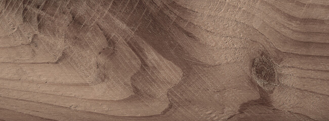 A close-up intricate grain patterns of a brown wooden plank. The natural texture and variations in color create a captivating aesthetic.