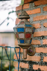 Garden lights mounted on a house wall, illuminating the exterior with a warm and inviting glow