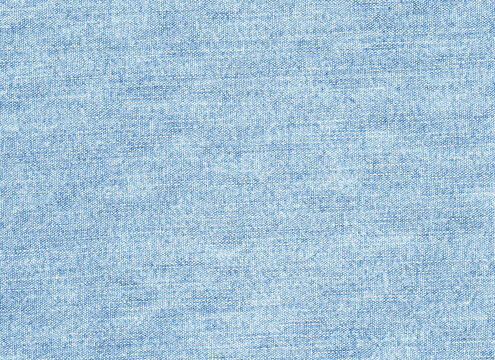 Stone washed light blue denim fabric texture background