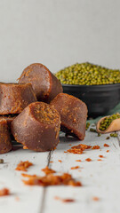 Discover the rich textures and warm tones of brown sugar and a variety of spices captured beautifully against a clean white background. 