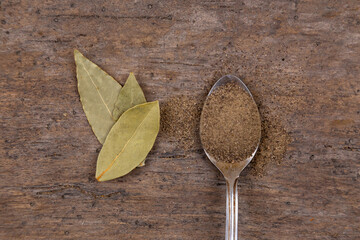 Bright spices over wooden background. Cooking or spicy food concept. Top view.