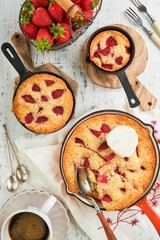 Strawberries chip skillet cookie or giant strawberries and cream frying pan cookie on rustic wooden table background. Traditional British or English dessert recipe. Top view. Place for text. Cover.